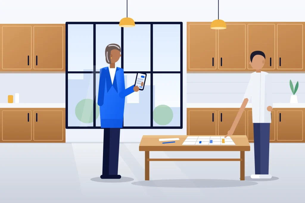 Dona de loja de móveis planejados confere no celular uma resposta de assistente de IA enquanto o assistente de marketing mostra uma planilha de monitoramento